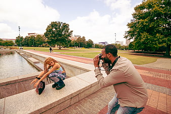 Photographer Taking Photos of Model in Urban Park