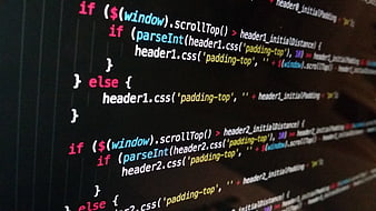 Close-up of JavaScript and jQuery code on a dark screen