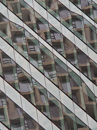 Abstract geometric pattern of modern glass building facade