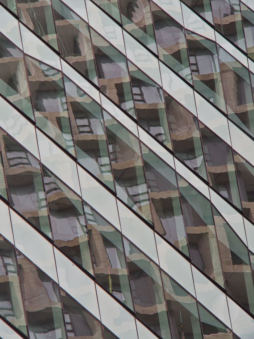 Abstract geometric pattern of modern glass building facade