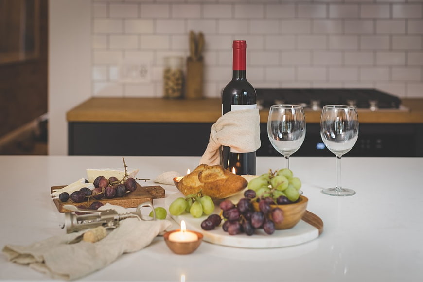Romantic Wine and Cheese Spread on Kitchen Counter