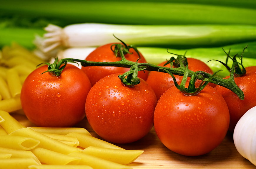 Fresh Tomatoes on Vine with Pasta and Vegetables