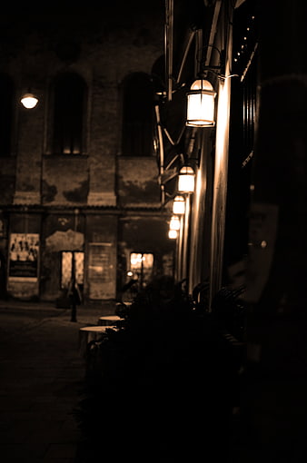 Sepia Night Street with Glowing Lanterns