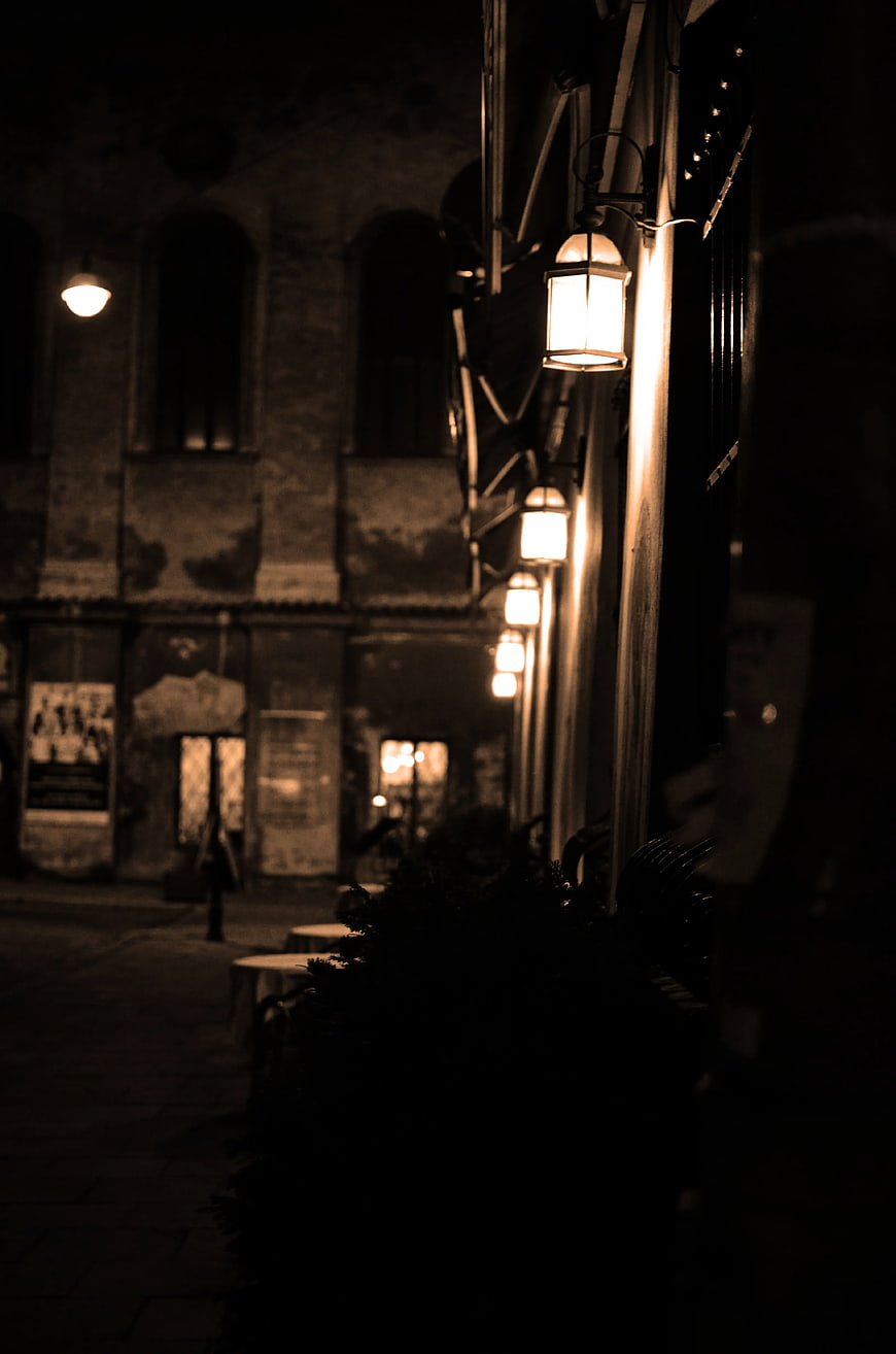 Sepia Night Street with Glowing Lanterns