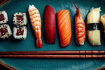 Assorted Sushi Platter with Chopsticks on Blue Plate