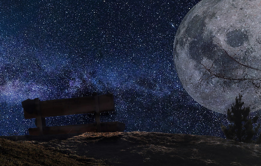 Wooden Bench Under Starry Night Sky With Giant Moon