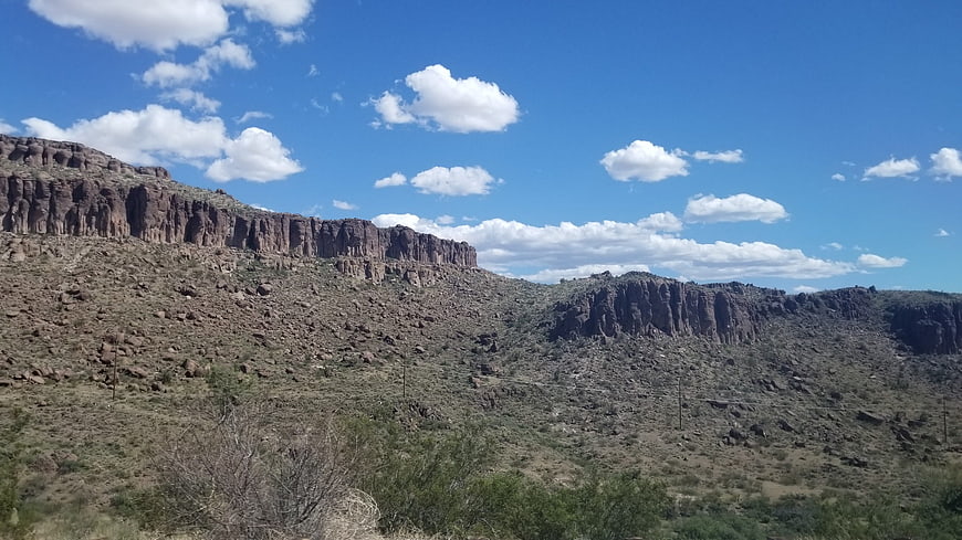 Red Rock Desert Landscape with Blue Sky and Clouds