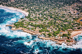Aerial View of Coastal Residential Area with Ocean Waves