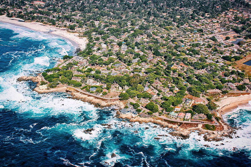 Aerial View of Coastal Residential Area with Ocean Waves