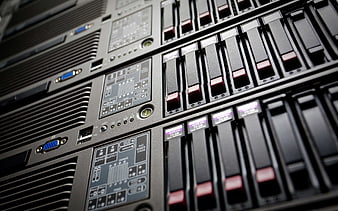 Close-up of server rack with hard drives and control panel