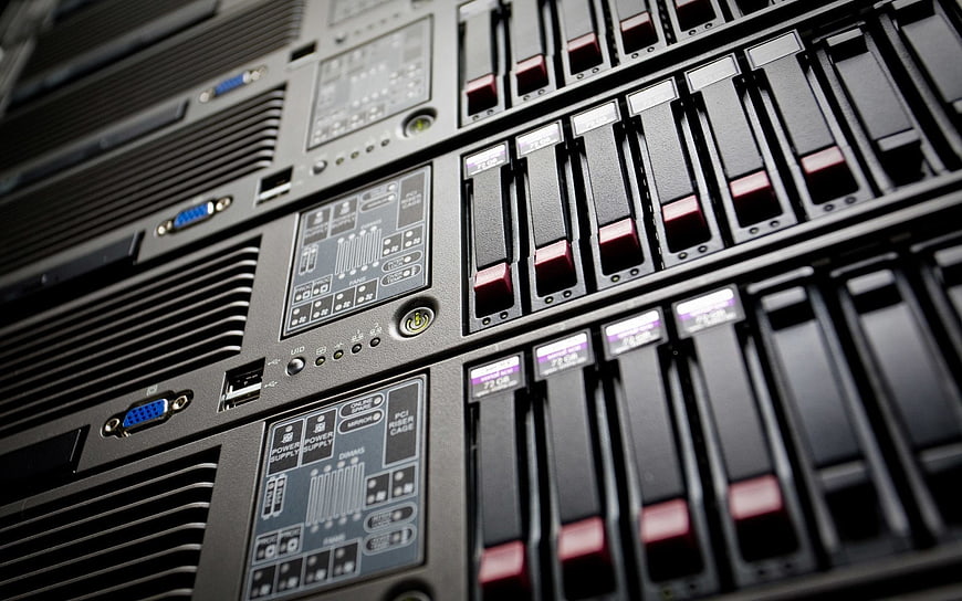 Close-up of server rack with hard drives and control panel