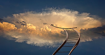Metal ladder reaching into golden clouds against blue sky