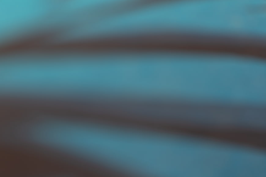 Abstract Blurred Teal and Brown Gradient Background