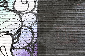 Abstract graffiti art on brick wall with copy space