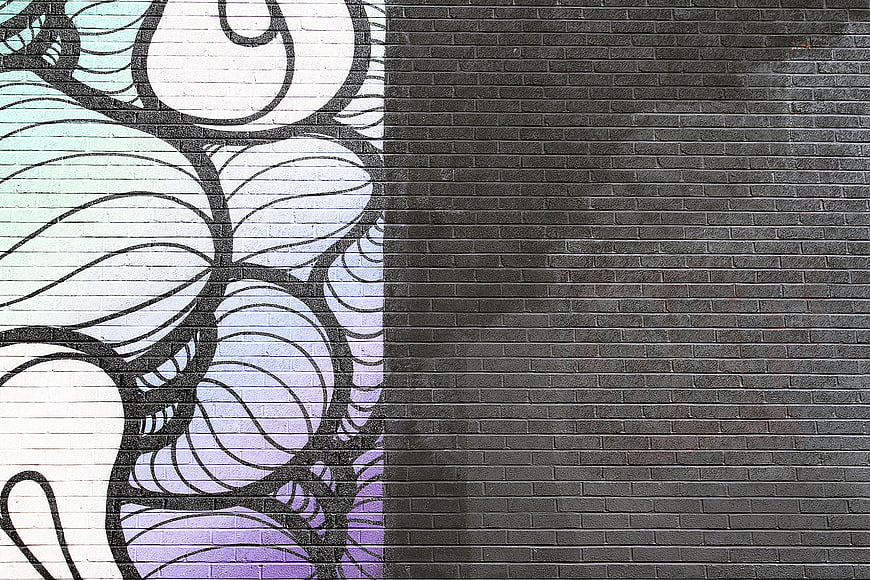 Abstract graffiti art on brick wall with copy space