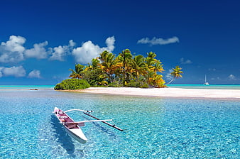Tropical Island with Catamaran in Turquoise Lagoon