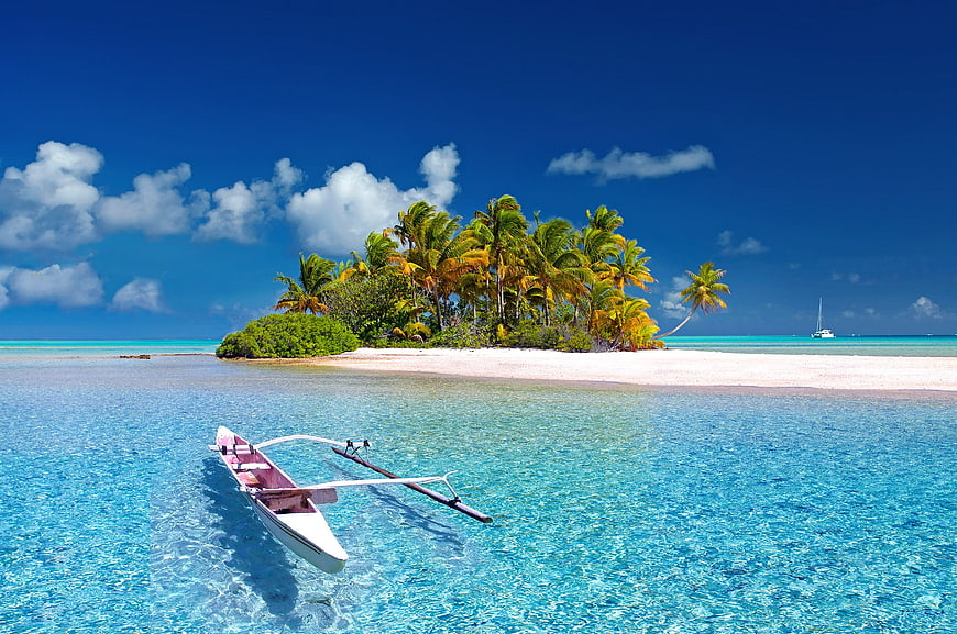 Tropical Island with Catamaran in Turquoise Lagoon