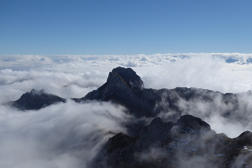 Majestic mountain peaks rising above a sea of clouds
