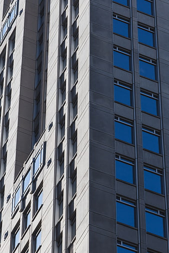 Modern Concrete Building Facade with Blue Windows