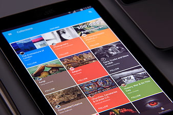 Tablet displaying photo app interface with colorful grid layout