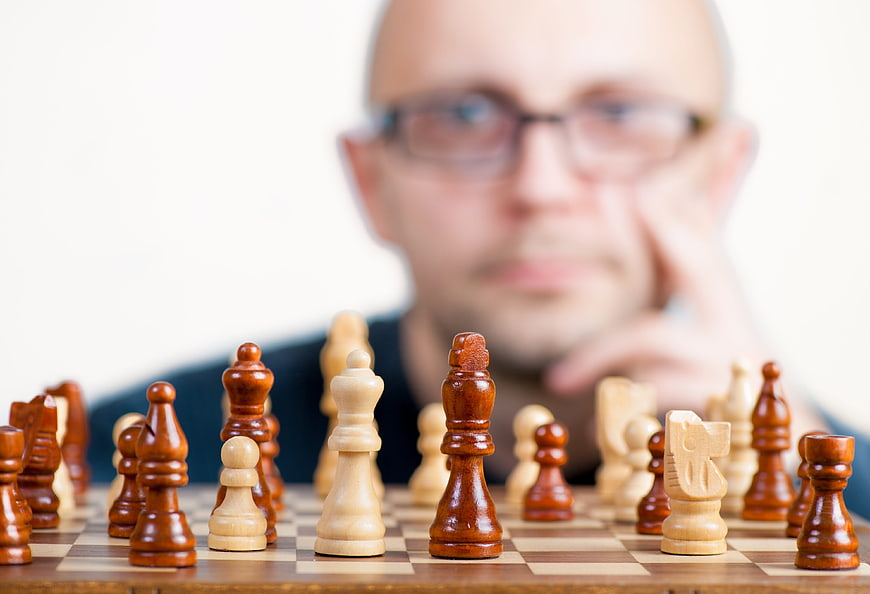 Man playing chess with blurred background