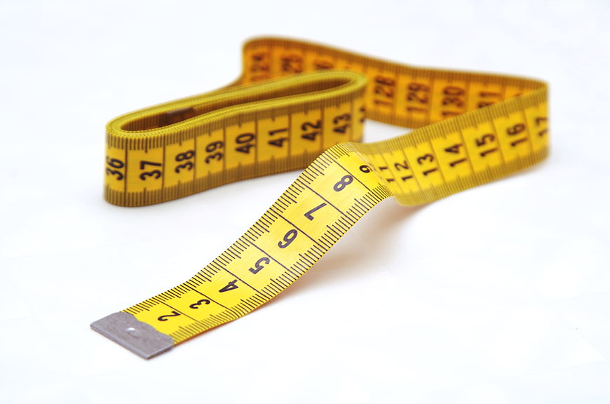 Yellow Measuring Tape On White Background