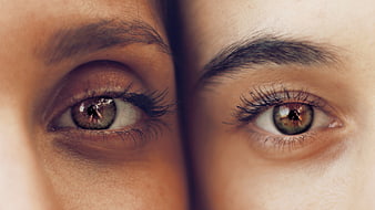 Close-up of two different eyes with distinct makeup styles