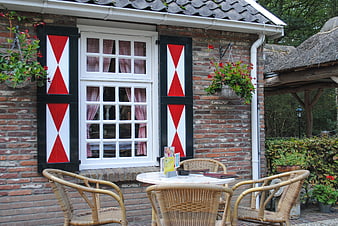 Traditional Dutch House with Red Shutters and Garden Terrace