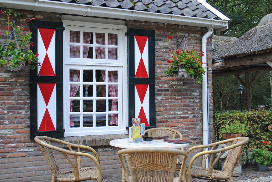 Traditional Dutch House with Red Shutters and Garden Terrace