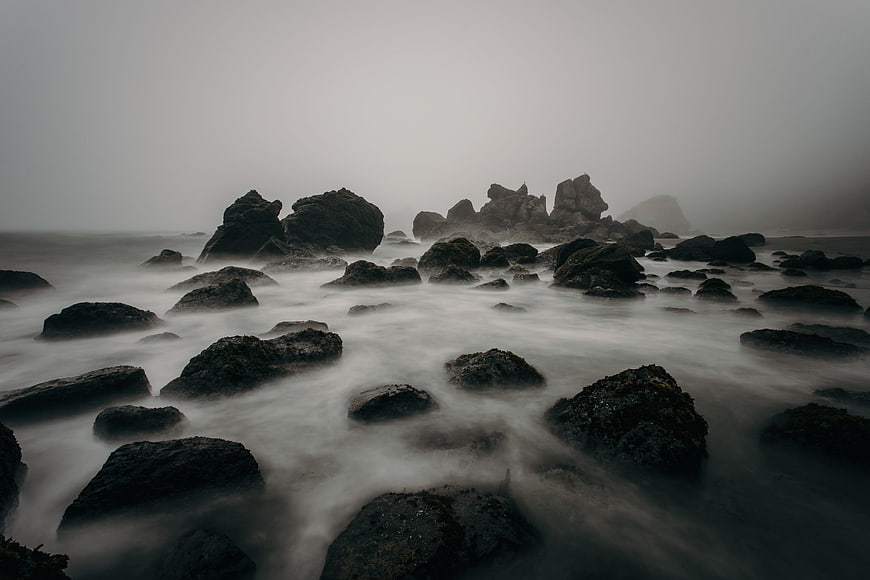 Misty Rocky Shoreline with Long Exposure Ocean Waves