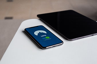 Smartphone with VPN App on White Table