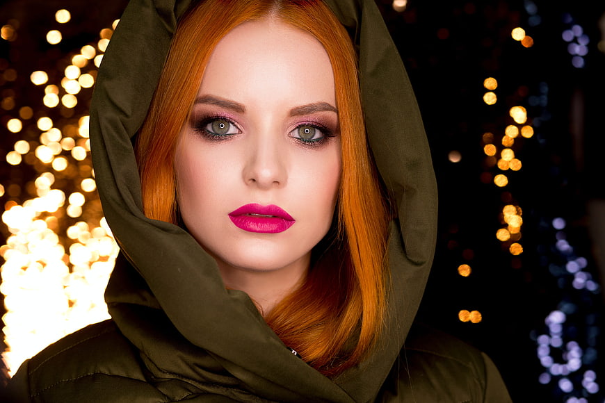 Portrait of Redhead Woman with Pink Lips and Bokeh Lights