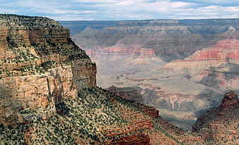 Grand Canyon Landscape with Red Rock Cliffs and Blue Sky