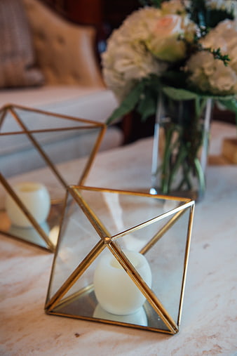 Geometric Gold Candle Holders on Marble Table