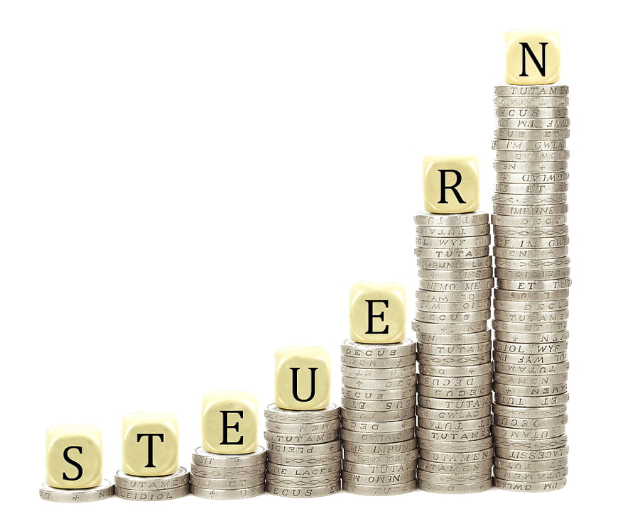 Stereogram of stacked coins and letter cubes on white background