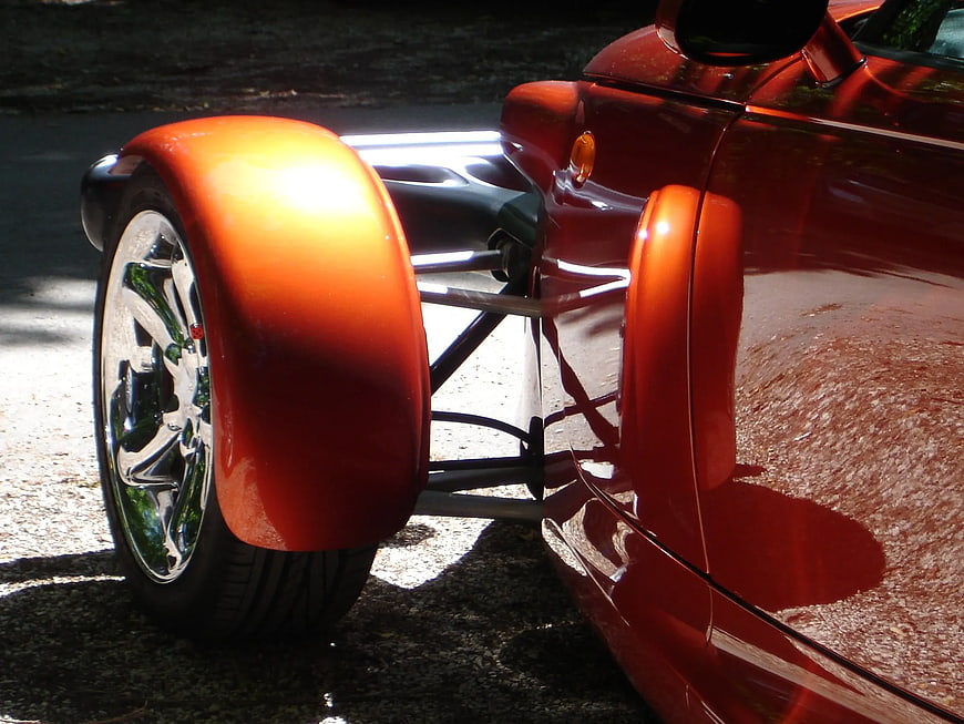 Close-up of Orange Classic Car Wheel and Fender