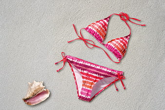 Pink Tie-Dye Bikini Set on Sand with Seashell
