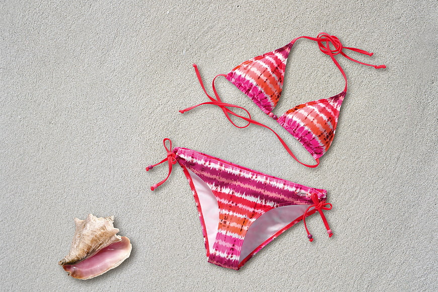 Pink Tie-Dye Bikini Set on Sand with Seashell