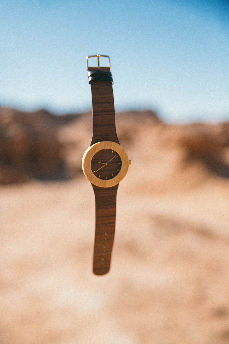 Wooden Watch Suspended in Desert Landscape