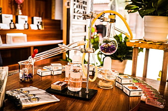 Essential Oil Distillation Setup with Lavender and Skincare Products