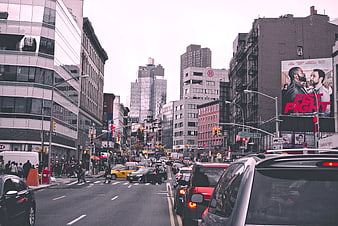 Busy New York City Street Scene with Traffic and Billboards