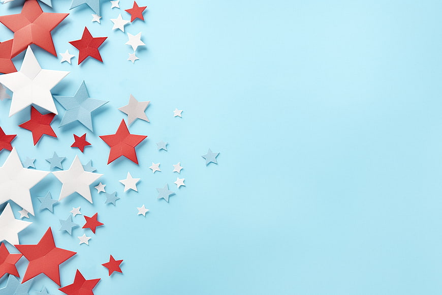 Red, White, and Blue Paper Stars on Light Blue Background