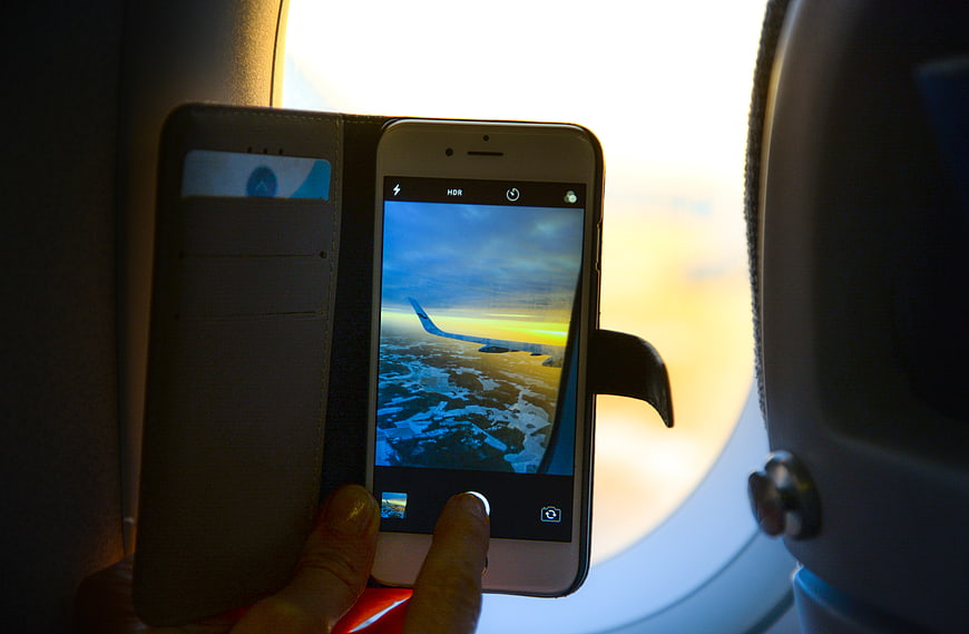 Taking Photo of Airplane Wing from Window with Smartphone