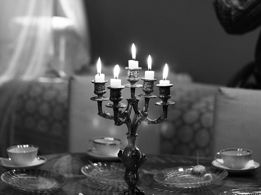 Vintage Candelabra with Lit Candles on Dining Table