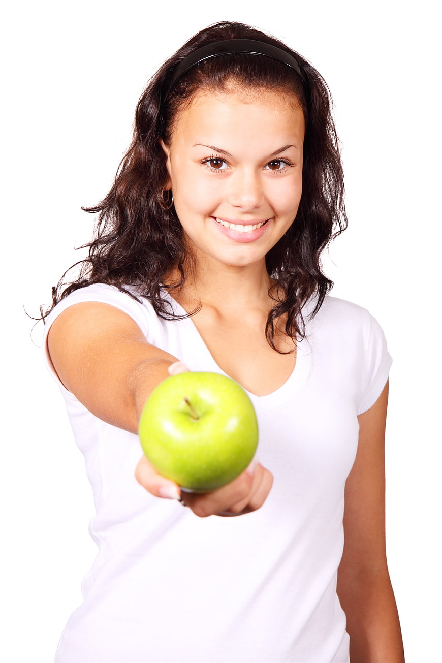 Smiling Woman Offering Green Apple on White Background