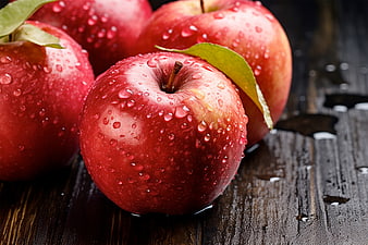 Fresh Red Apples with Water Droplets on Dark Wood
