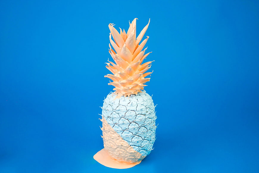 Artistic Blue and Peach Painted Pineapple on Blue Background