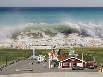 Dramatic Tsunami Wave Crashing Over Coastal Town and Beach