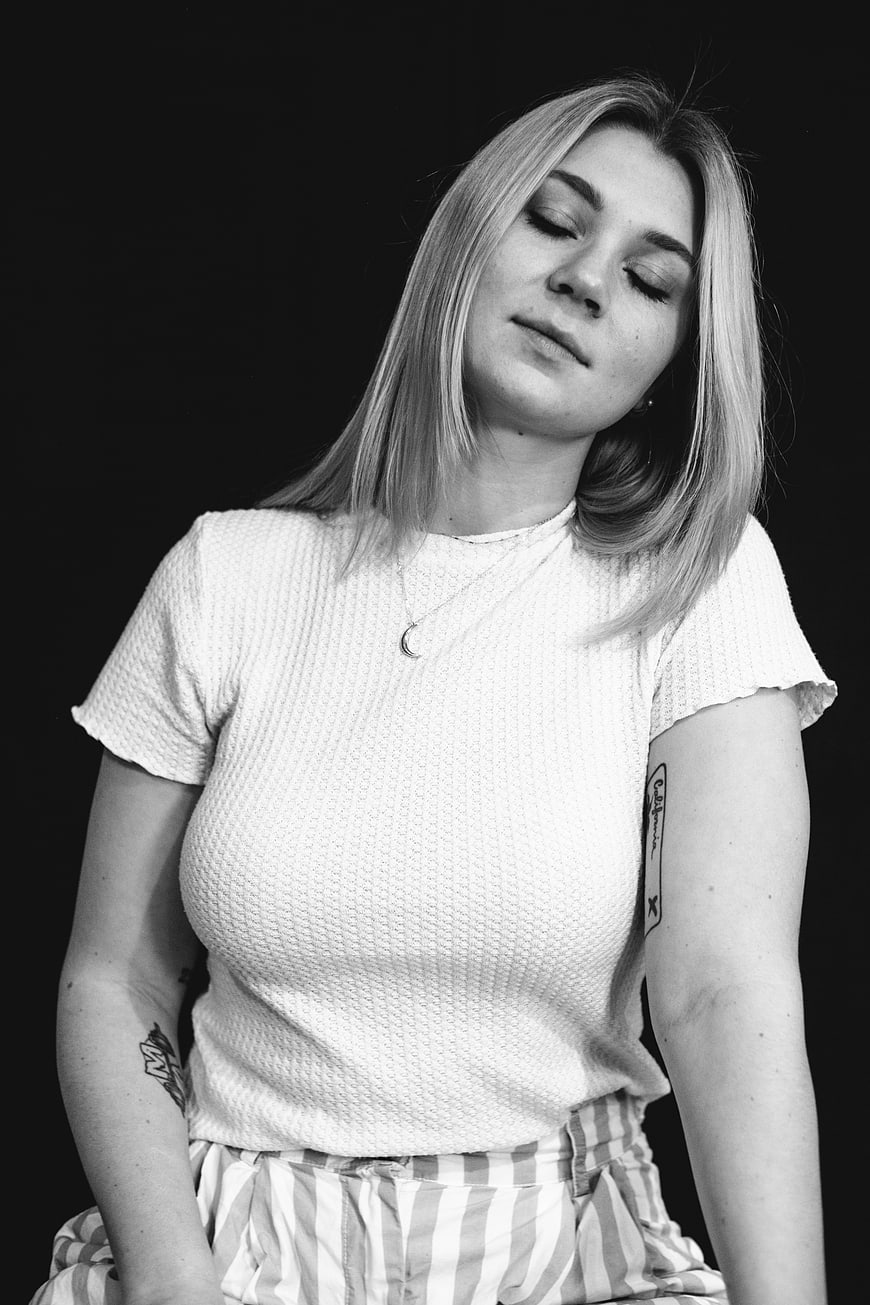 Serene Black and White Portrait of Young Woman with Closed Eyes