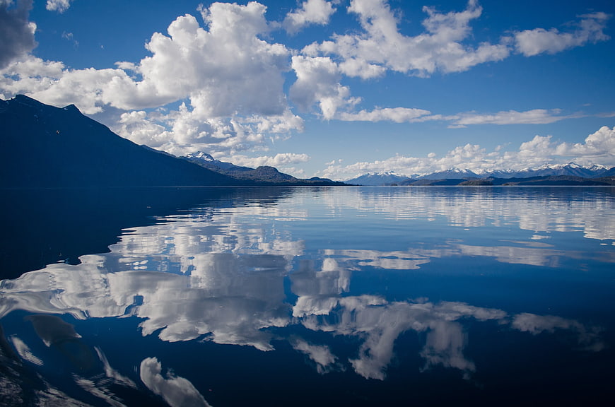 Serene Lake Landscape with Cloud Reflections and Mountains